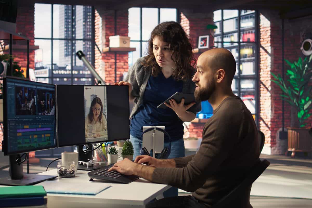 rofessional editor uses ai powered software and pc reels in a creative office