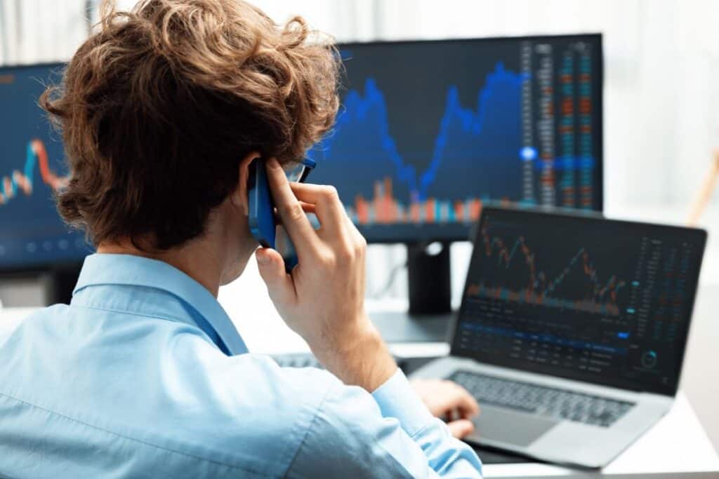 Successful investor stock trader calling smartphone to business partner gusher